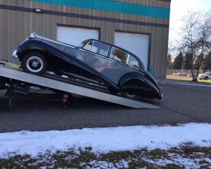 A 1957 Rolls Royce Silver Cloud displayed for sale, showcasing its classic design and elegant features.